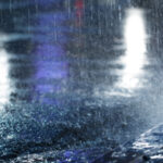 hard-rain-fall-night-with-blurry-cars-selective-focus
