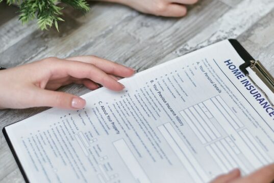 https://www.pexels.com/photo/person-holding-home-insurance-form-7731332/