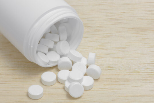 https://www.vecteezy.com/photo/1262646-pills-spilling-out-of-pill-bottle-on-wood-back-ground