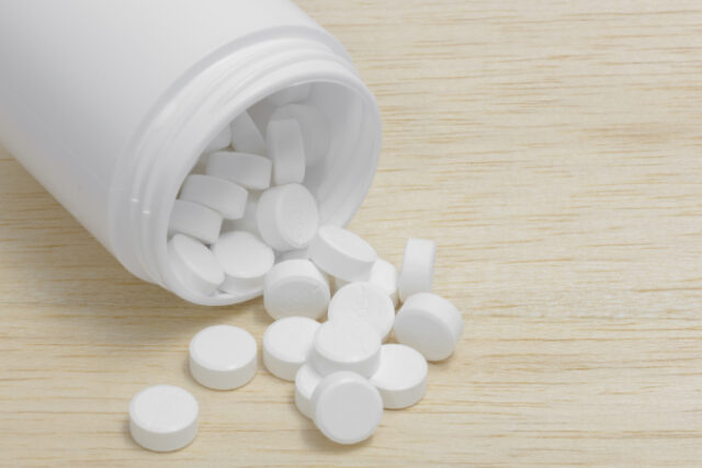 https://www.vecteezy.com/photo/1262646-pills-spilling-out-of-pill-bottle-on-wood-back-ground
