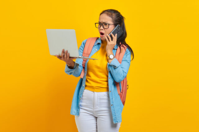 https://www.vecteezy.com/photo/6166956-portrait-of-surprised-young-asian-woman-student-in-casual-clothes-with-backpack-talking-on-mobile-phone-and-using-laptop-isolated-on-yellow-background-education-in-college-university-concept