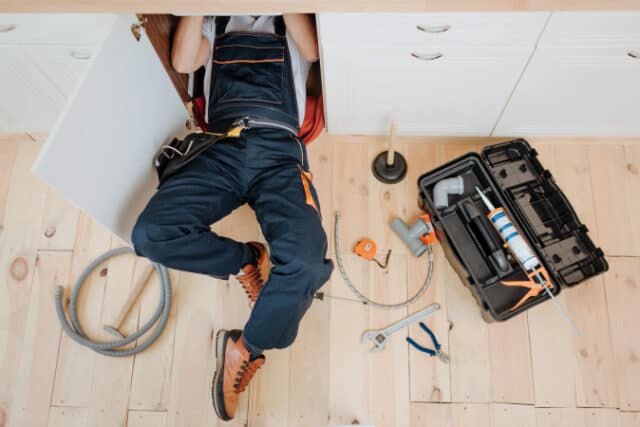 https://www.freepik.com/premium-photo/man-uniform-work-kitchen-sink_8053850.htm#query=plumber&position=28&from_view=search