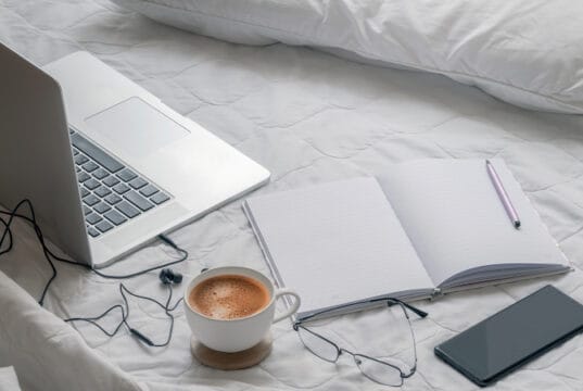 https://www.vecteezy.com/photo/1309972-laptop-with-a-coffee-phone-and-notebook-on-a-bed