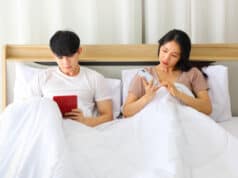 https://www.vecteezy.com/photo/7185897-asian-couple-looking-at-each-other-smartphone-for-social-media-while-laying-down-in-the-bed-planning-for-their-upcoming-wedding