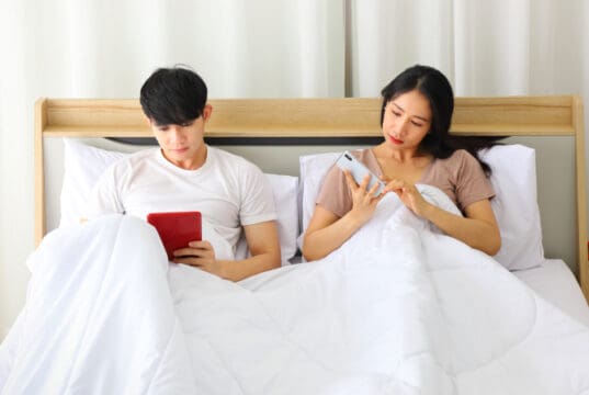 https://www.vecteezy.com/photo/7185897-asian-couple-looking-at-each-other-smartphone-for-social-media-while-laying-down-in-the-bed-planning-for-their-upcoming-wedding