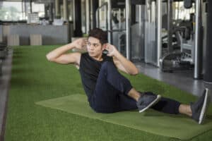 https://www.vecteezy.com/photo/1229609-man-doing-cruches-in-a-gym