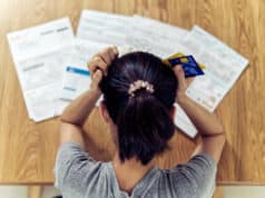 https://www.freepik.com/premium-photo/top-view-stressed-young-sitting-asian-woman-hands-holding-head-worry-about-find-money-pay-credit-card-debt-all-loan-bills_4545002.htm#query=debt&position=7&from_view=search
