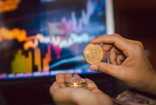 https://www.vecteezy.com/photo/7467672-business-men-holding-bitcoin-whit-computer-trading-chart-in-background