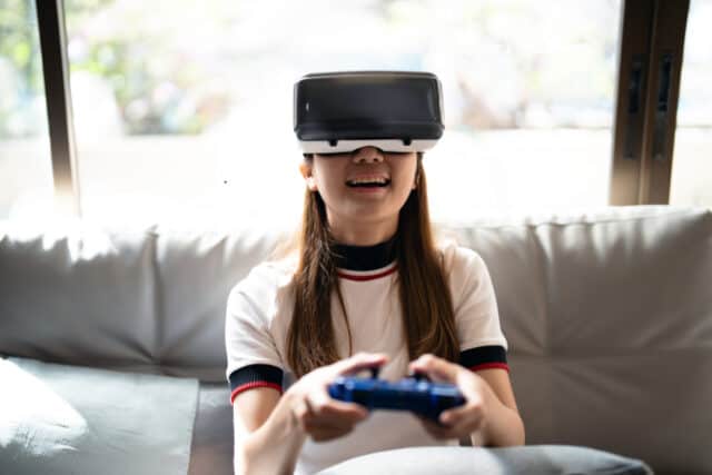 https://www.vecteezy.com/photo/8570652-concept-of-technology-gaming-entertainment-and-people-asian-woman-enjoying-virtual-reality-glasses-while-relaxing-in-living-room-happy-young-guy-with-vr-headset-playing-video-game-at-home