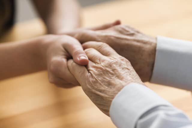 https://www.vecteezy.com/photo/2327829-nurse-holding-senior-mans-hands-with-empathy