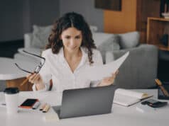 https://www.vecteezy.com/photo/7799068-smiling-glad-italian-woman-paying-bills-online-at-home-while-sitting-on-living-room