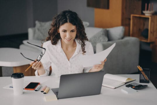 https://www.vecteezy.com/photo/7799068-smiling-glad-italian-woman-paying-bills-online-at-home-while-sitting-on-living-room
