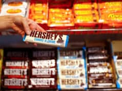 An employee shows a Hershey's chocolate bar made in USA in the "American lifestyle" store in Berlin, Germany, August 13, 2018. REUTERS/Fabrizio Bensch