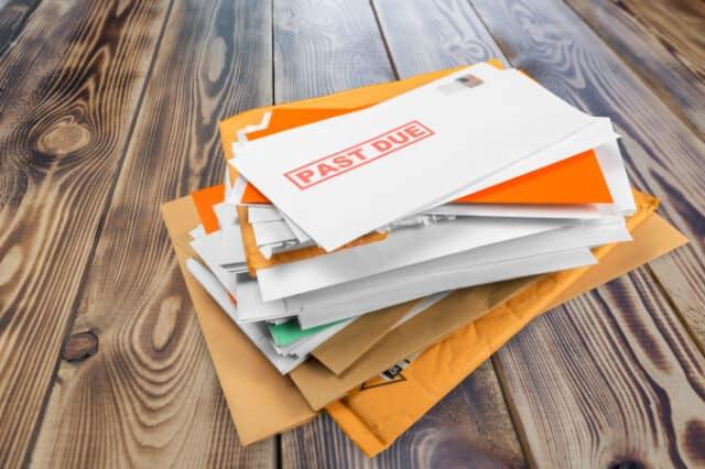 Pile of envelopes with overdue utility bills on the desk https://www.freepik.com/premium-photo/pile-envelopes-with-overdue-utility-bills-desk_23813229.htm#query=past%20due&position=15&from_view=search
