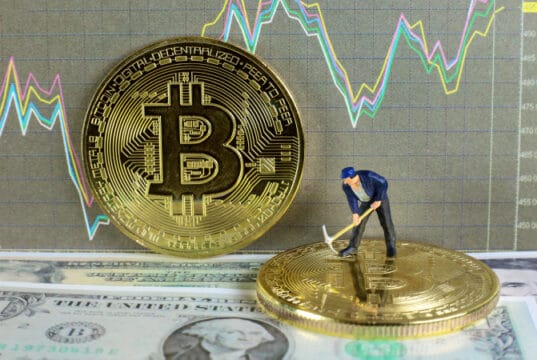 https://www.vecteezy.com/photo/7021620-a-little-miner-is-digging-on-golden-bitcoin-with-dollar-and-graph-background-conceptual-image-of-bitcoin-mining-and-trading
