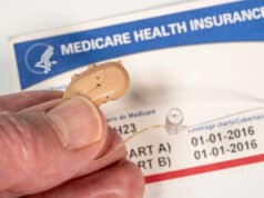 https://www.vecteezy.com/photo/7221137-close-up-of-tiny-modern-hearing-aids-on-medicare-card-background