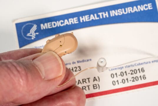 https://www.vecteezy.com/photo/7221137-close-up-of-tiny-modern-hearing-aids-on-medicare-card-background