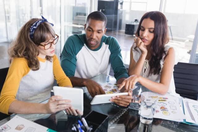 https://www.vecteezy.com/photo/1177911-creative-business-people-discussing-over-digital-tablets-at-office