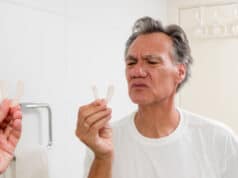 https://www.vecteezy.com/photo/5419490-man-putting-in-his-night-guard-in-front-of-a-mirror