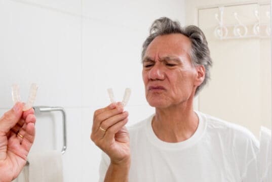 https://www.vecteezy.com/photo/5419490-man-putting-in-his-night-guard-in-front-of-a-mirror