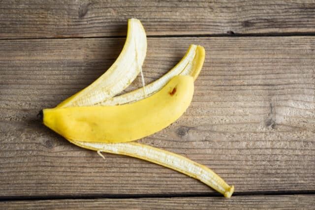 banana peel on wooden background, Ripe banana peel on floor - top view https://www.vecteezy.com/photo/6168528-banana-peel-on-wooden-background-ripe-banana-peel-on-floor-top-view