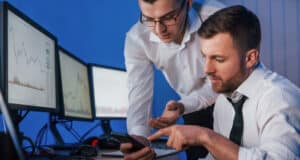 https://www.vecteezy.com/photo/8220274-different-information-on-screens-two-stock-traders-working-in-the-office-with-exchange-technology