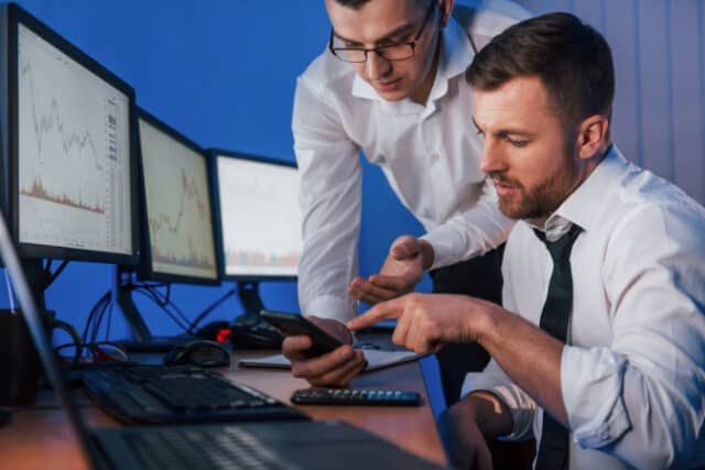 https://www.vecteezy.com/photo/8220274-different-information-on-screens-two-stock-traders-working-in-the-office-with-exchange-technology