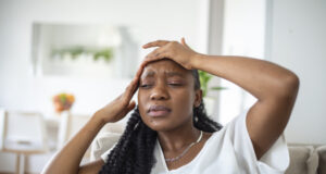 https://www.freepik.com/free-photo/portrait-young-black-girl-sitting-couch-home-with-headache-pain-beautiful-woman-suffering-from-chronic-daily-headaches-sad-woman-holding-her-head-because-sinus-pain_27156398.htm#query=migraine&position=23&from_view=search