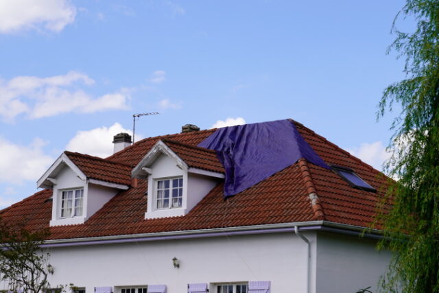 roof-needs-repairs-covered-with-tarp-waiting-roofing-company-fix-after-spring-summer-thunderstorm https://www.freepik.com/premium-photo/roof-needs-repairs-covered-with-tarp-waiting-roofing-company-fix-after-spring-summer-thunderstorm_32057914.htm#query=hurricane%20roof&position=5&from_view=search