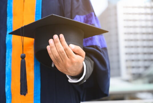 https://www.vecteezy.com/photo/1227549-close-up-of-graduate-holding-graduation-cap