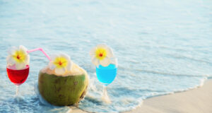 https://www.vecteezy.com/photo/10104760-cocktail-glasses-with-coconut-and-pineapple-on-clean-sand-beach-fruit-and-drink-on-sea-beach-backgroudn-concept