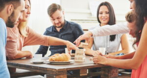 https://www.vecteezy.com/photo/6240661-group-of-creative-friends-sitting-at-wooden-table-people-having-fun-while-playing-board-game