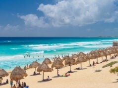 https://www.vecteezy.com/photo/10342139-umbrelas-on-a-sandy-beach-with-azure-water-on-a-sunny-day-near-cancun-mexico