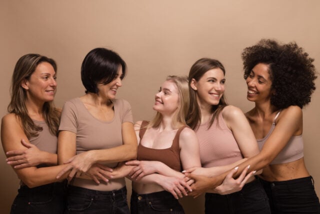 https://www.freepik.com/free-photo/beautiful-ladies-different-ages-nations-brown-tops-look-each-other-holding-hands-beige-background_26258313.htm#query=women&position=2&from_view=search