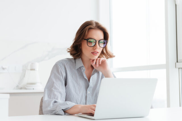 https://www.freepik.com/free-photo/charming-businesswoman-glasses-striped-shirt-working-with-laptop-computer-while-siting-home_7725015.htm#query=blue%20light%20glasses&position=23&from_view=search&track=sph