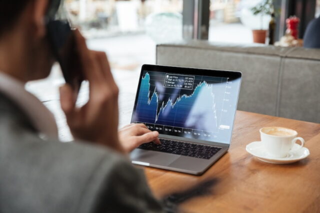 https://www.freepik.com/free-photo/cropped-image-businessman-sitting-by-table-cafe-analyzing-indicators-laptop-computer-while-talking-by-smartphone_6876013.htm#query=stock%20market%20cryptocurrency&position=12&from_view=search