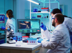 https://www.freepik.com/free-photo/microbiologist-doctor-taking-blood-sample-tube-from-rack-with-machines-analysis-lab-background_15785908.htm#query=science%20lab&position=16&from_view=search&track=sph