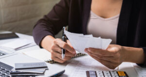 https://www.freepik.com/premium-photo/stressed-young-woman-checking-bills-taxes-bank-account-balance-calculating-expenses-living-room-home_6337669.htm#query=bill%20paying&position=15&from_view=search&track=sph
