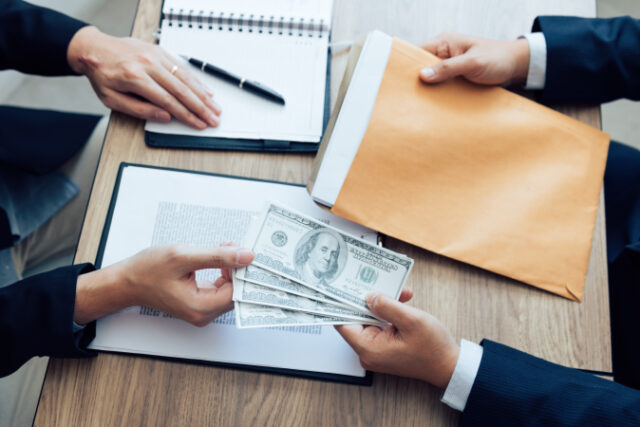vecteezy_entrepreneurs-are-receiving-money-that-is-a-bribe-of-their_5407275_478 https://www.vecteezy.com/photo/5407275-entrepreneurs-are-receiving-money-that-is-a-bribe-of-their-partners-with-both-of-whom-are-corrupt-in-the-company-room