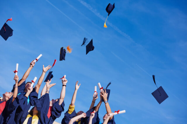 high school students graduates tossing up hats over blue sky. https://www.vecteezy.com/photo/11922157-high-school-graduates-students