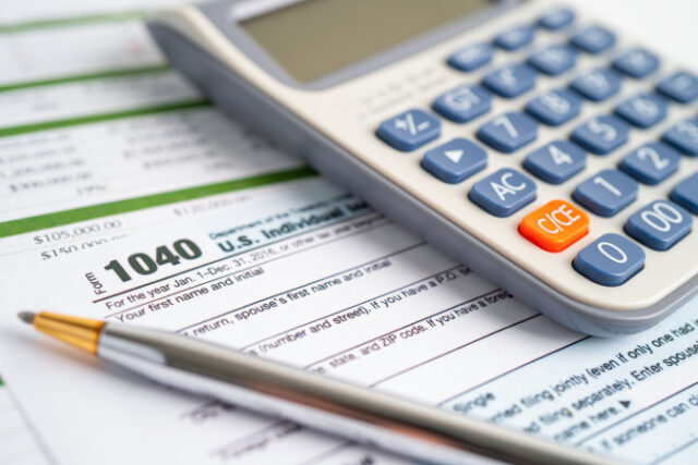 Tax Return form 1040 and dollar banknote, U.S. Individual Income. https://www.vecteezy.com/photo/3536388-tax-return-form-1040-and-dollar-banknote-u-s-individual-income