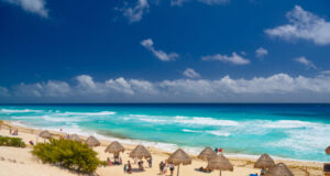 https://www.vecteezy.com/photo/10648018-umbrelas-on-a-sandy-beach-with-azure-water-on-a-sunny-day-near-cancun-mexico
