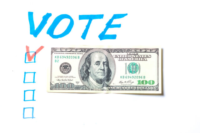 Buying votes of voters concept. Vote, dollars on a white background. https://www.freepik.com/premium-photo/buying-votes-voters-concept-vote-dollars-white-background_26600441.htm#query=money%20ballot&position=9&from_view=search&track=sph
