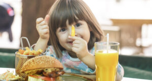 https://www.freepik.com/free-photo/little-cute-girl-eating-fast-food-sandwich-with-fries-orange-juice-cafe-fast-food-concept_10107501.htm#query=child%20eating&position=5&from_view=search&track=sph