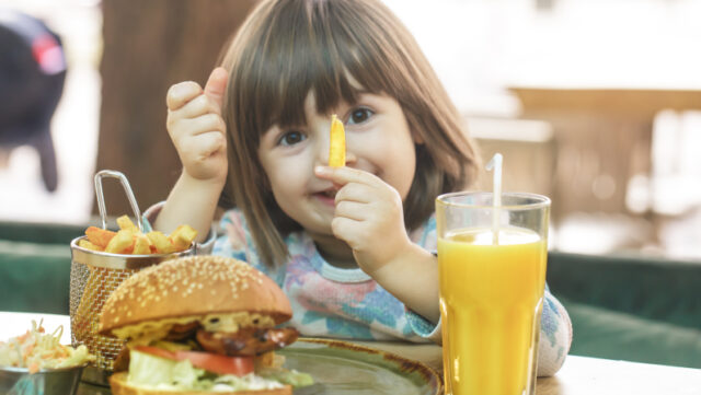 https://www.freepik.com/free-photo/little-cute-girl-eating-fast-food-sandwich-with-fries-orange-juice-cafe-fast-food-concept_10107501.htm#query=child%20eating&position=5&from_view=search&track=sph