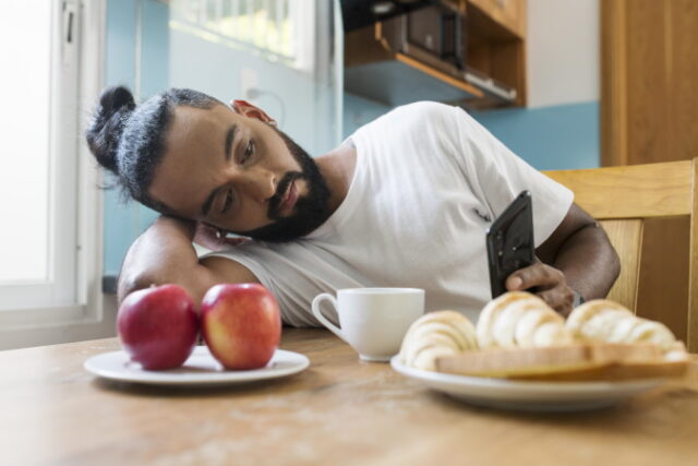 man-being-tired-while-taking-his-breakfast https://www.freepik.com/free-photo/man-being-tired-while-taking-his-breakfast_15632079.htm#query=tired%20breakfast&position=27&from_view=search&track=sph