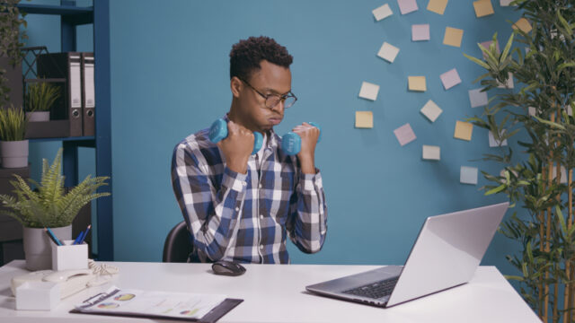 https://www.freepik.com/free-photo/office-worker-exercising-with-dumbbells-train-muscles-while-he-uses-laptop-desk-employee-lifting-weights-doing-physical-activity-with-fitness-exercise-working-computer-business_24689081.htm#page=2&query=desk%20exercise&position=2&from_view=search&track=sph
