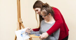 https://www.freepik.com/free-photo/side-view-woman-helping-girl-with-down-syndrome-paint_7088480.htm#query=autism&position=49&from_view=search&track=sph