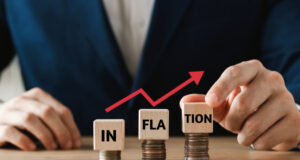 https://www.vecteezy.com/photo/13074341-businessman-puts-a-wooden-cube-on-the-coin-and-the-word-inflation-considering-the-rate-hikes-of-central-banks-in-all-countries-of-the-world-controlling-inflation
