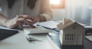 https://www.vecteezy.com/photo/10110692-buying-and-selling-houses-and-real-estate-prices-concept-woman-using-calculator-to-count-rent-money-or-home-insurance-cost-calculating-mortgage-loan-or-investment